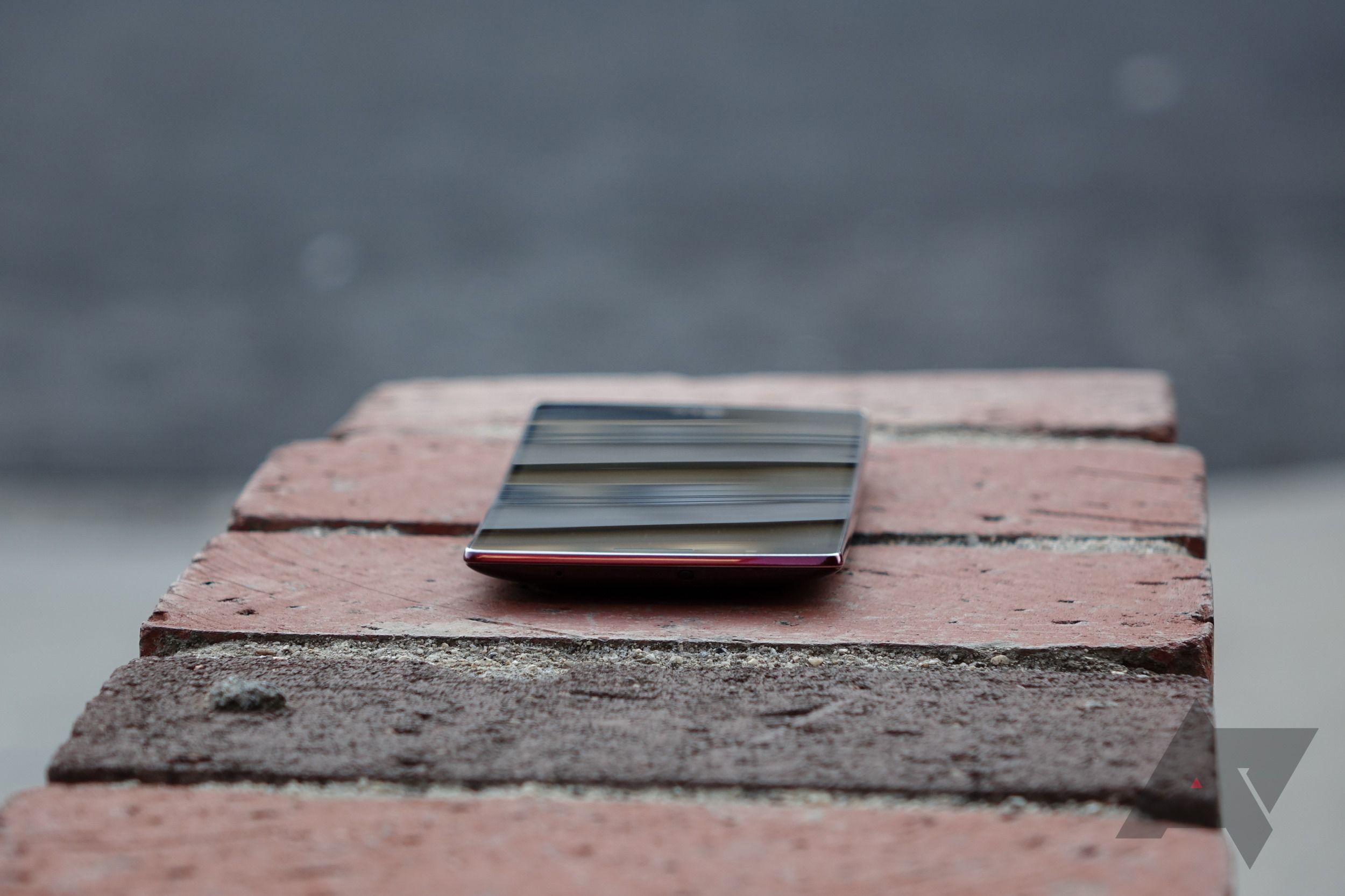 LG G Flex 2 laying on bricks folded open