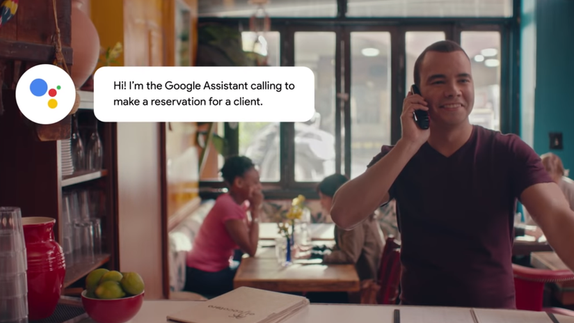 A man holding a phone while there is a popup of Google Duplex making a call