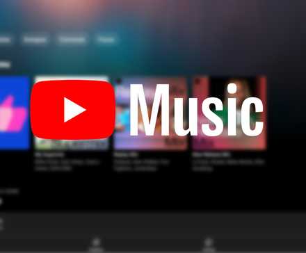The YouTube Music logo against a blurred image of the YouTube app