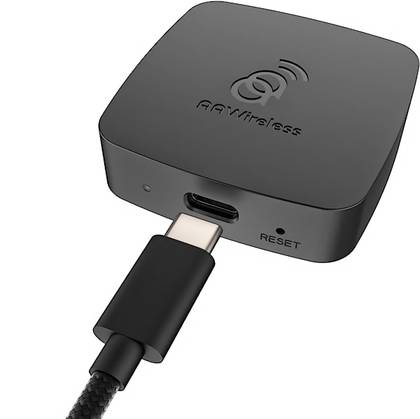An AAWireless adapter with a USB cable near its port
