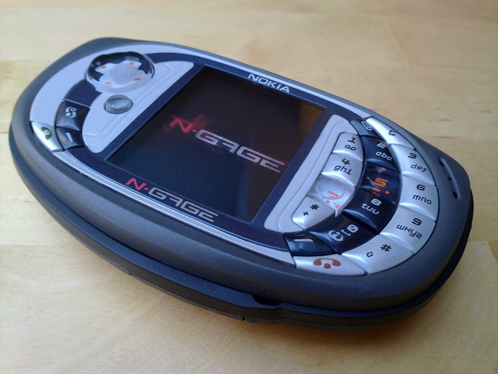 Nokia N-Gage QD laying on table screen up with logo showing