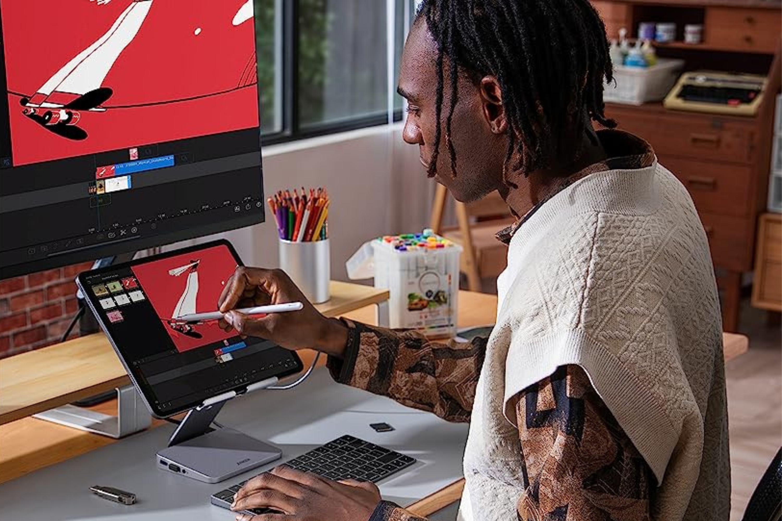 Person using Anker 551 USB-C Hub with tablet and stylus