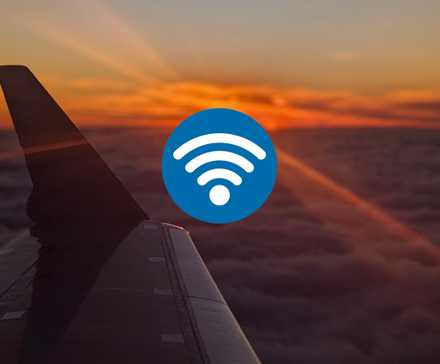 Wi-Fi logo and photo of an sunset seen from an airplane