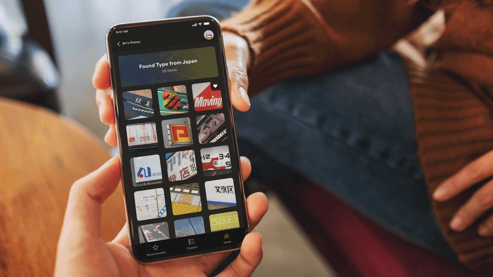 The Plex Photos app open on a smartphone held by two people