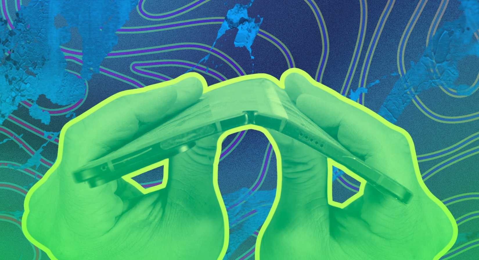 Two hands holding a foldable phone and bending it until the screens cracks