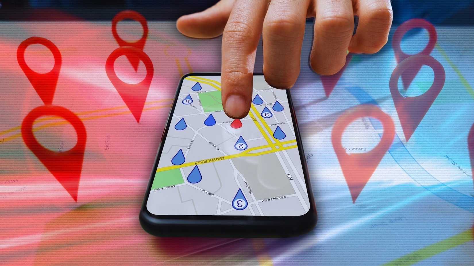 Finger placing red tags on Google Maps
