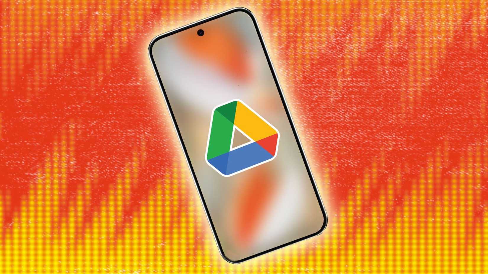 O logotipo do Google Drive em um smartphone contra um fundo amarelo e laranja