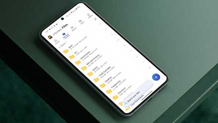 I used this one photograph cleanup app to do away with loads of pictures in 10 mins An Android phone with a cloud storage app sits atop a gray table.