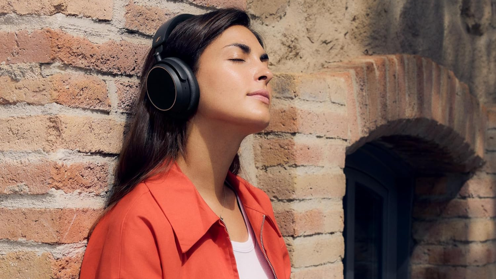 Person wearing Sennheiser ACCENTUM Wireless Bluetooth Headphones