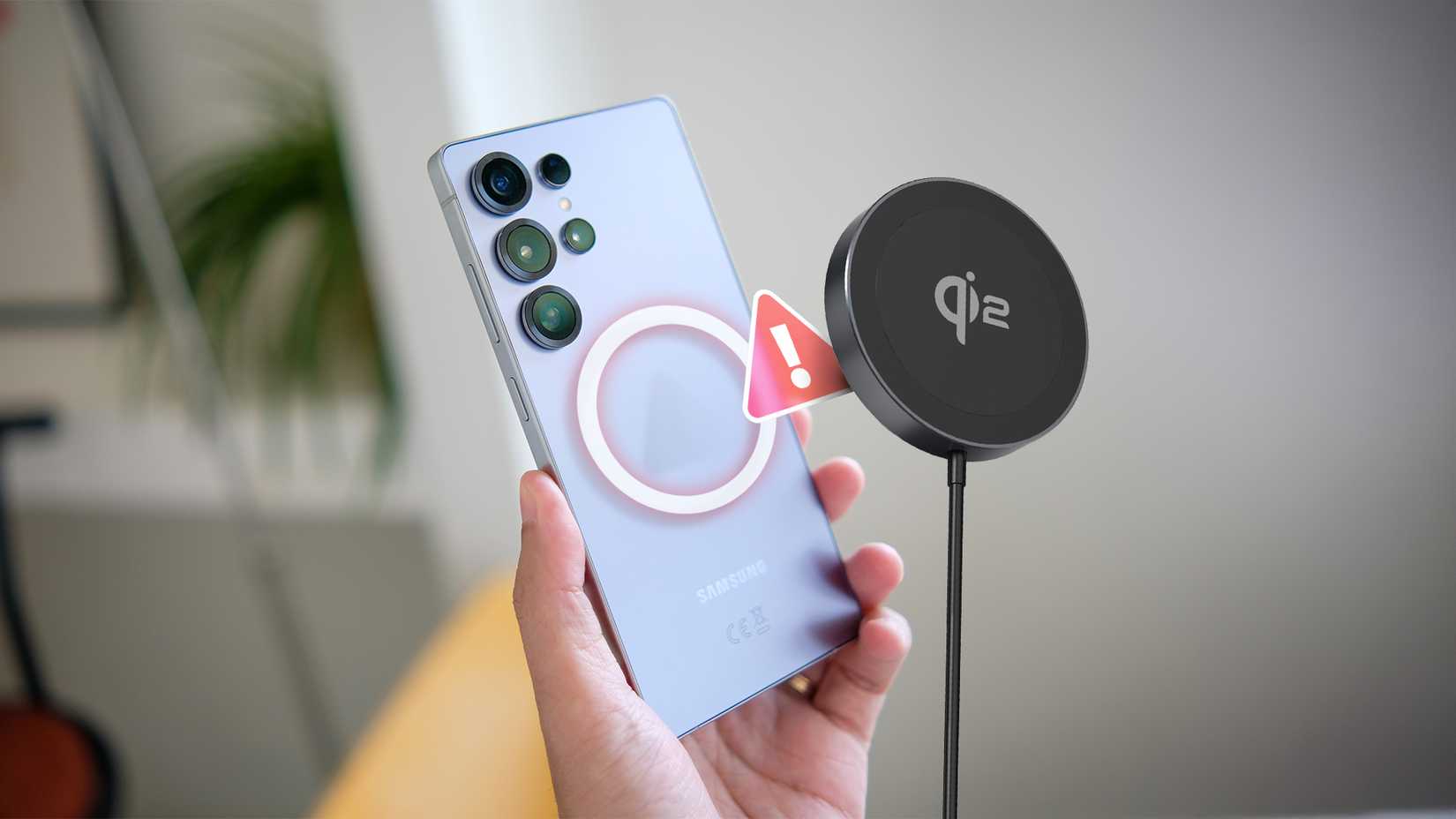 A hand holding a Galaxy S25 with a Qi2 charger next to it and an alert in the middle.
