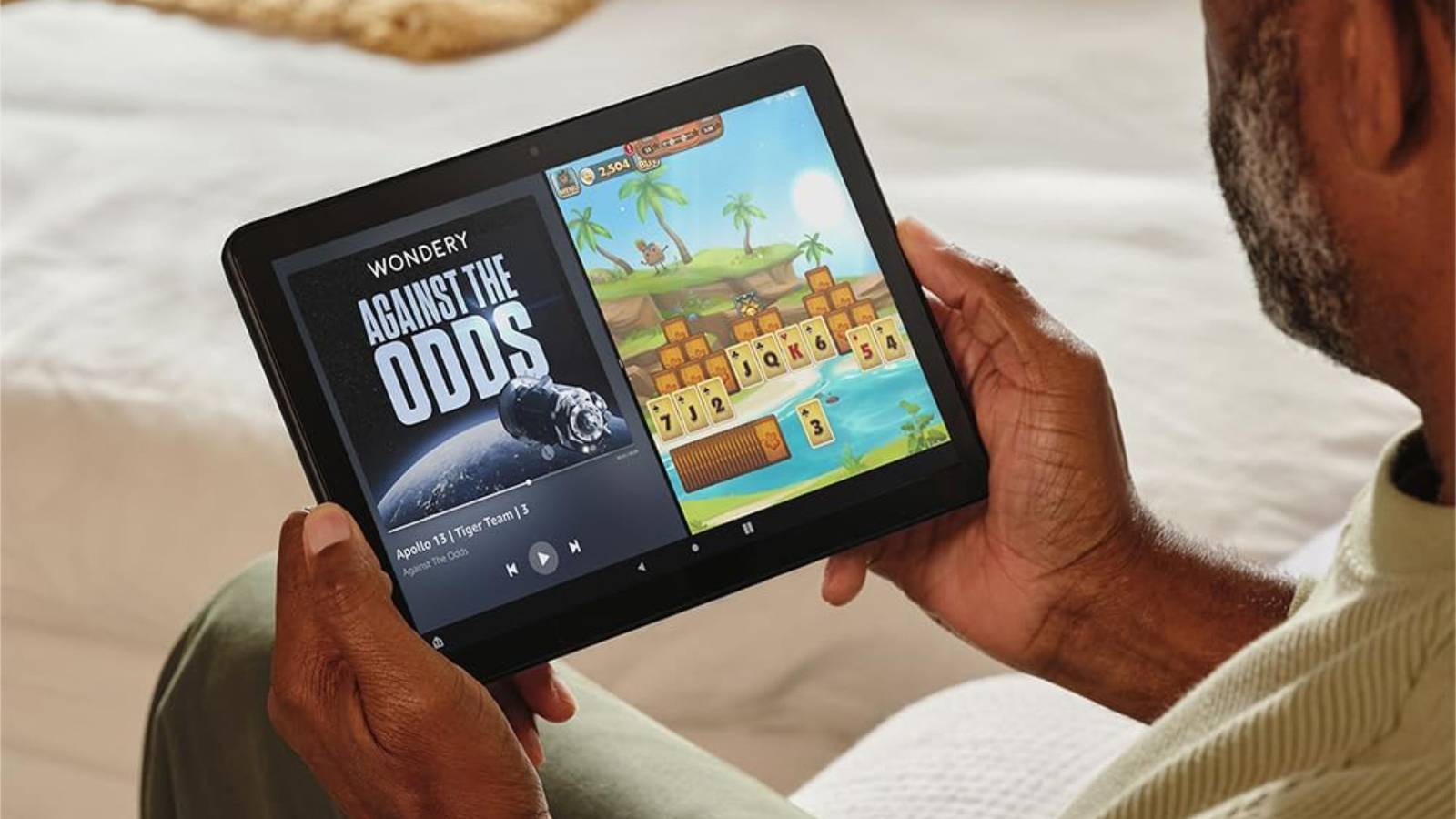 Looking at content on the Amazon Fire HD 10 tablet.
