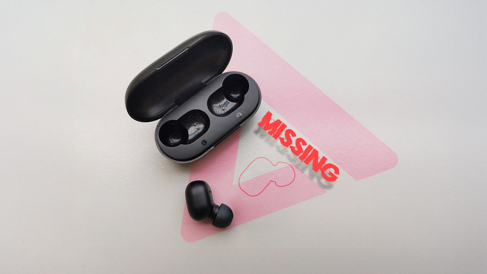 An earbud with a warning next to it saying the other one is missing.