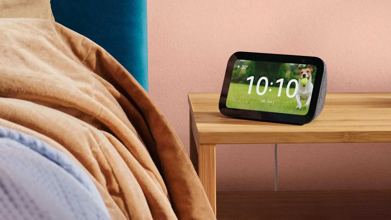 The Amazon Echo Show 5 on a bedside table.