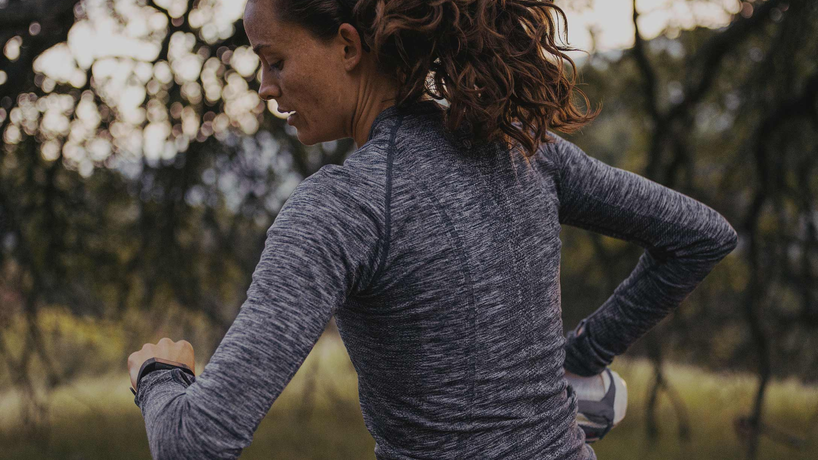 Person running looking at watch 
