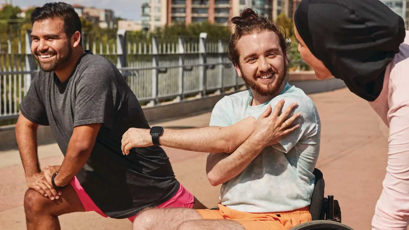 Wearing a Fitbit Versa 4 while stretching.