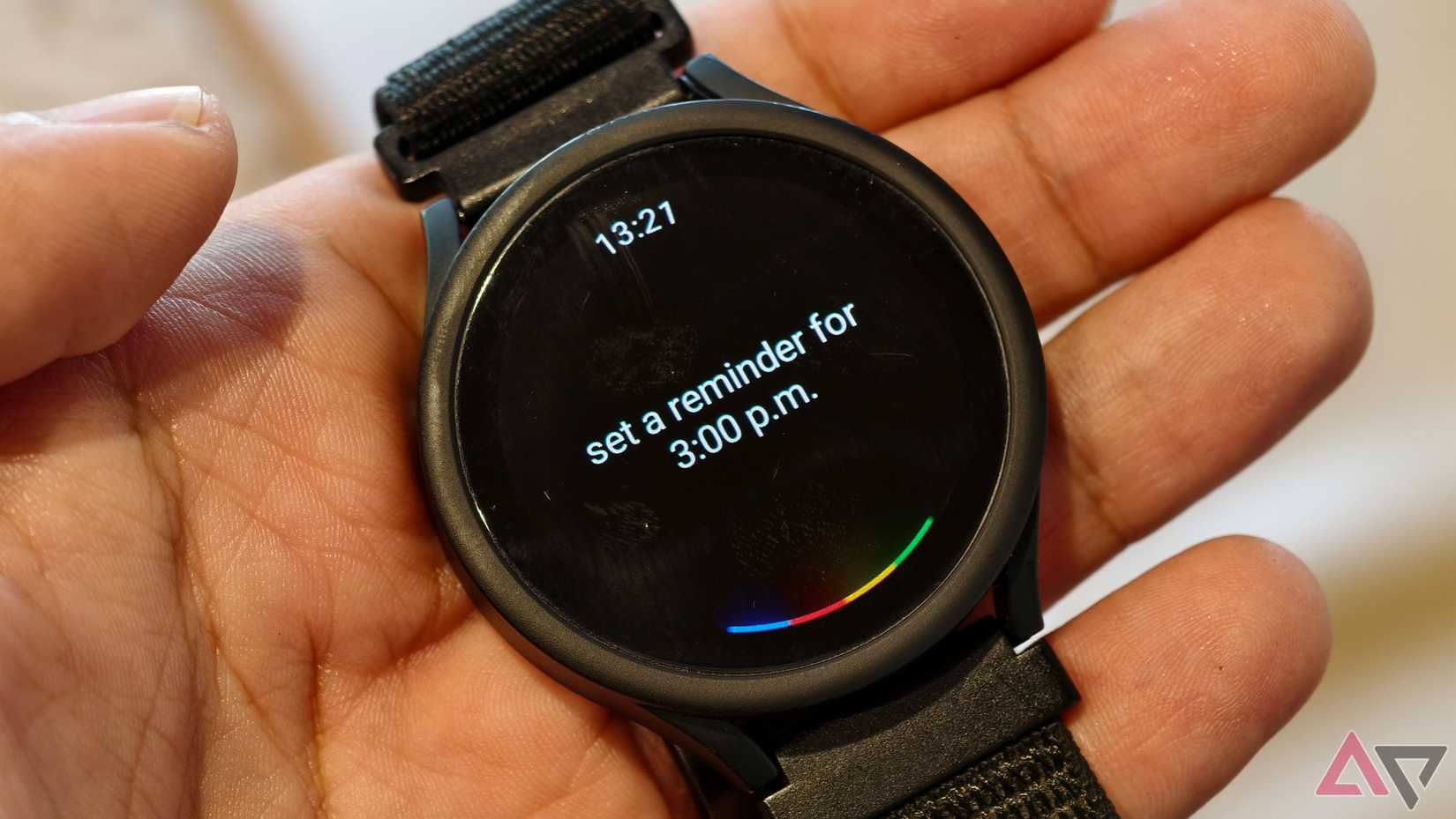 A Samsung Galaxy Watch 4 showing Google Assistant on the watchface