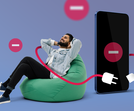 Man relaxing on a beanbag disconnected from a large smartphone displaying a 'Do Not Disturb' symbol.