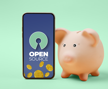 A piggy bank beside a smartphone displaying an open source icon, with gold coins scattered around.