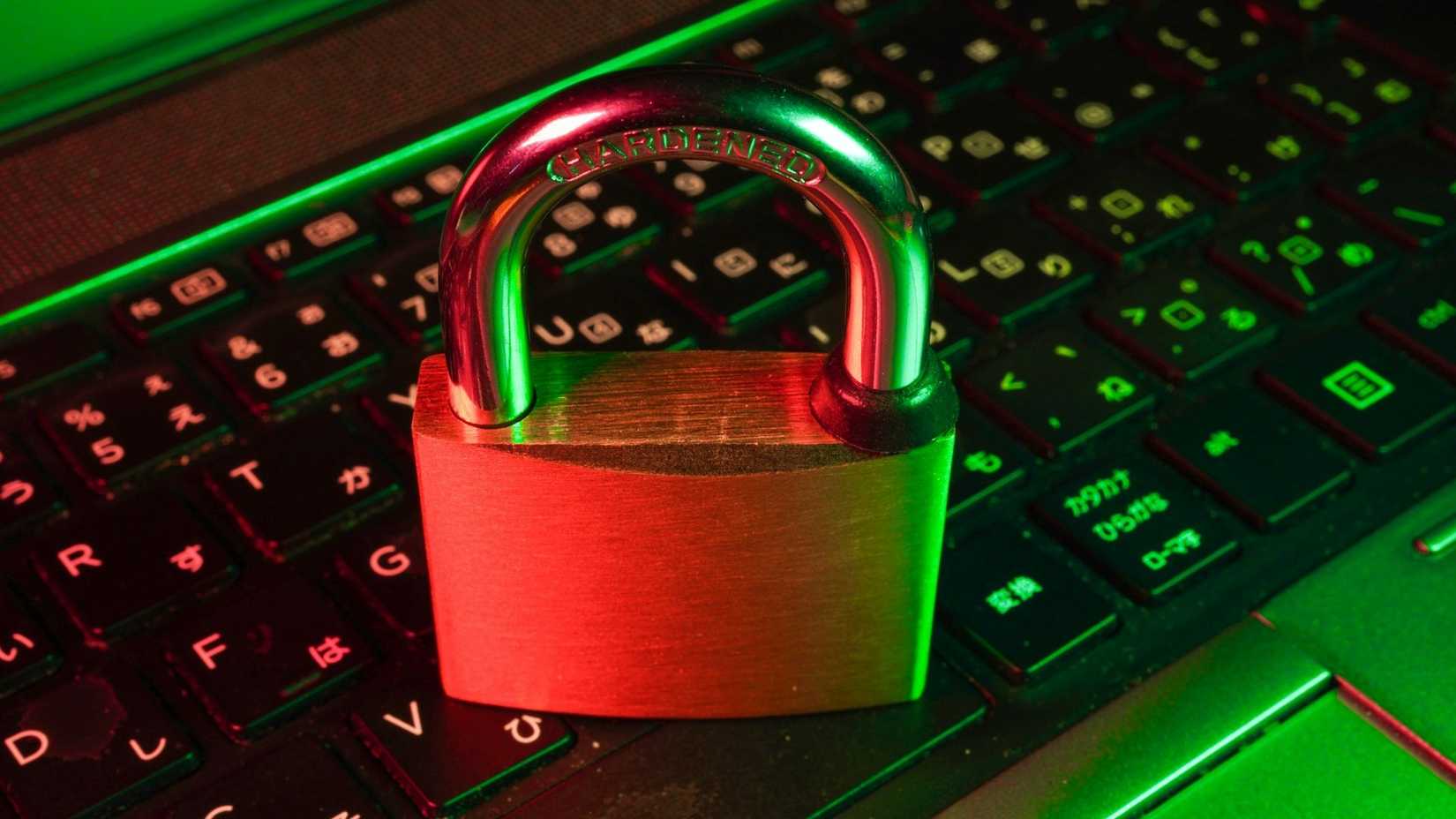 A lock placed on top of a keyboard to depict online security