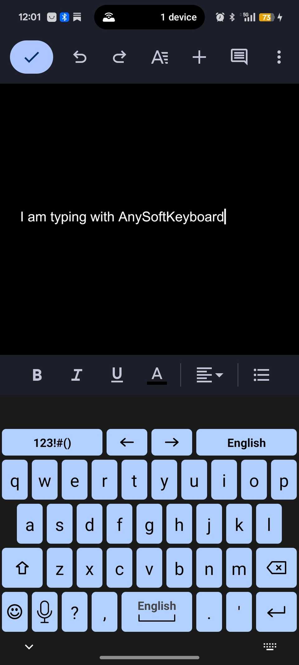 Open keyboard with blue keys being used for typing in Google Docs