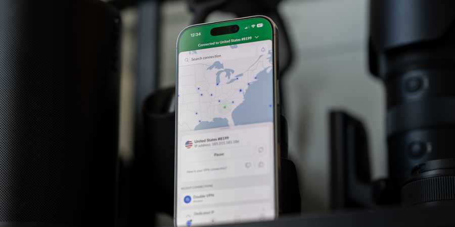 NordVPN running on an iPhone standing on a table.