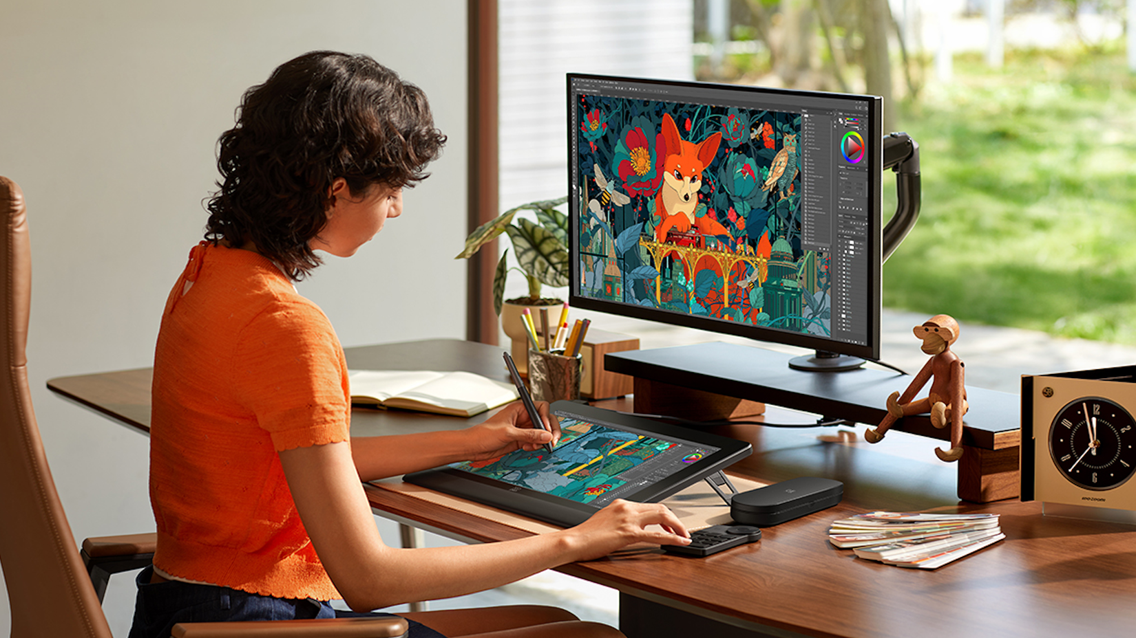 A woman working on a design in her home office using the XPPen Artist Ultra 16