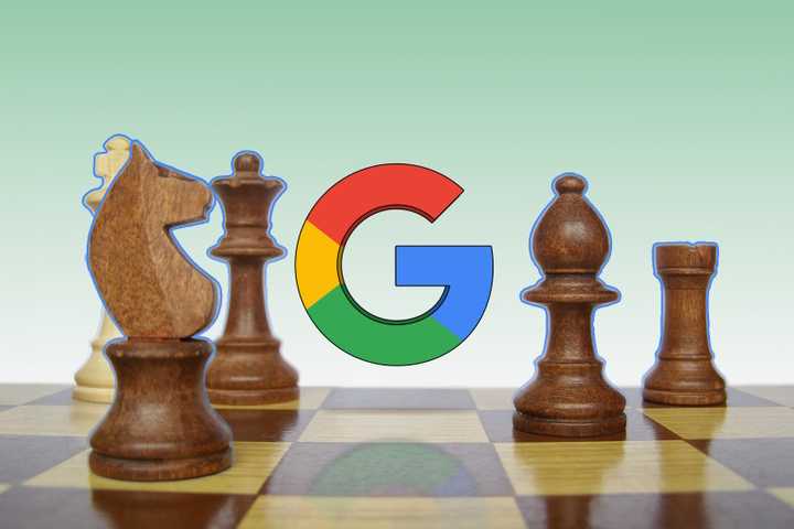 Chess pieces arranged on a board with the Google logo in the center.