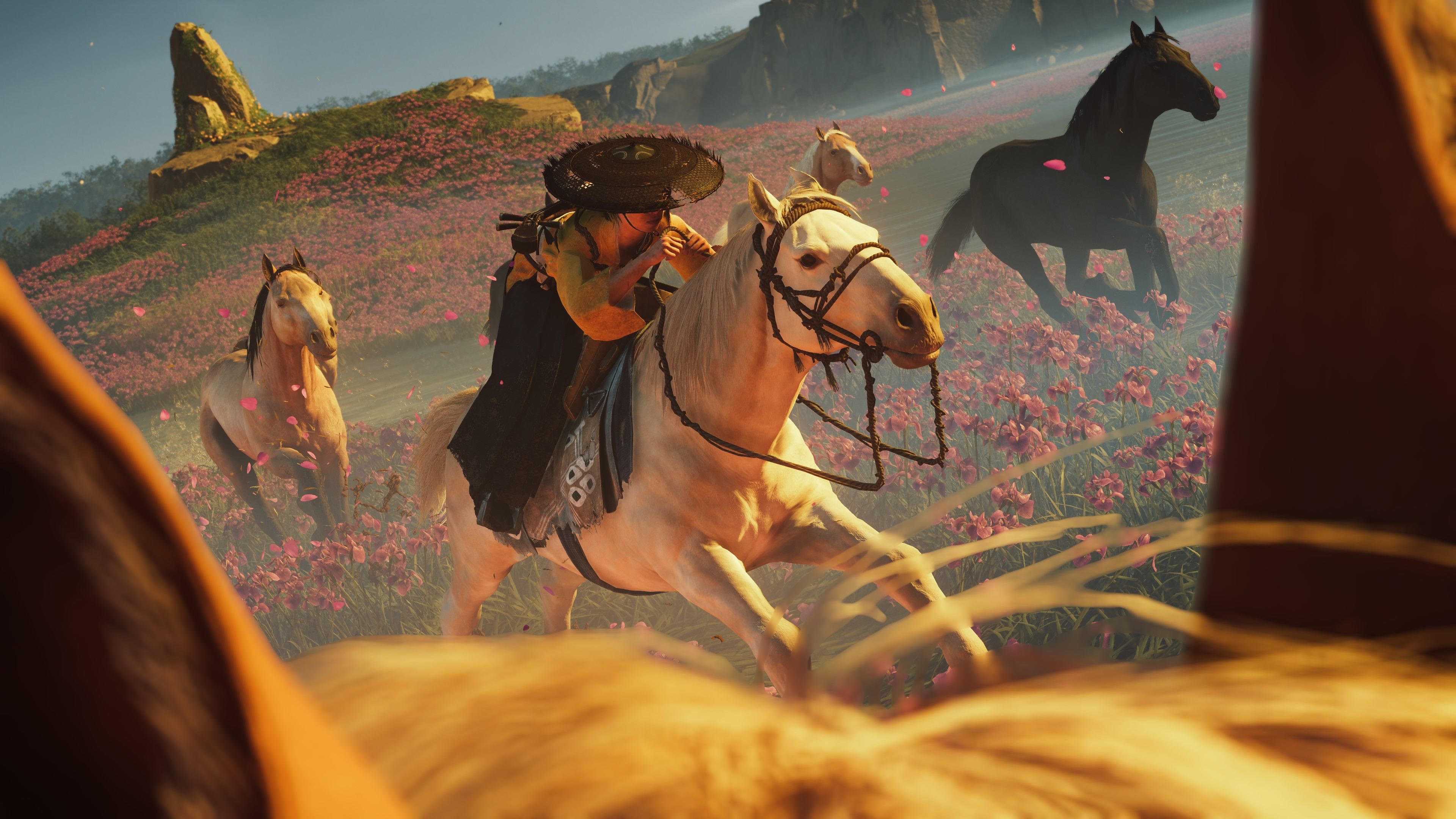 A photo of Atsu riding a horse taken to show off Ghost of Yotei's photo mode on PlayStation Blog
