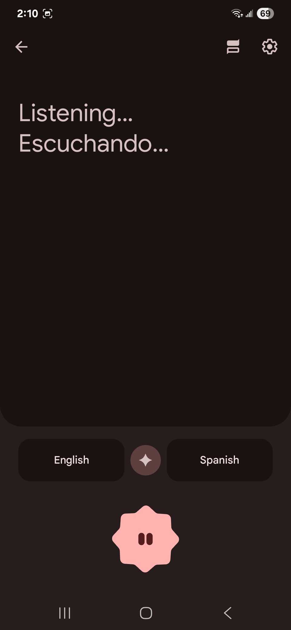 Conversation page on the Google Translate with the listening and text prompts and language selection at the bottom of the app