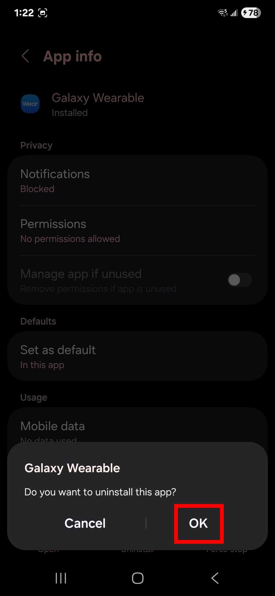 Highlighting the Ok button to confirm uninstalling the Galaxy Wearable app from the App info page