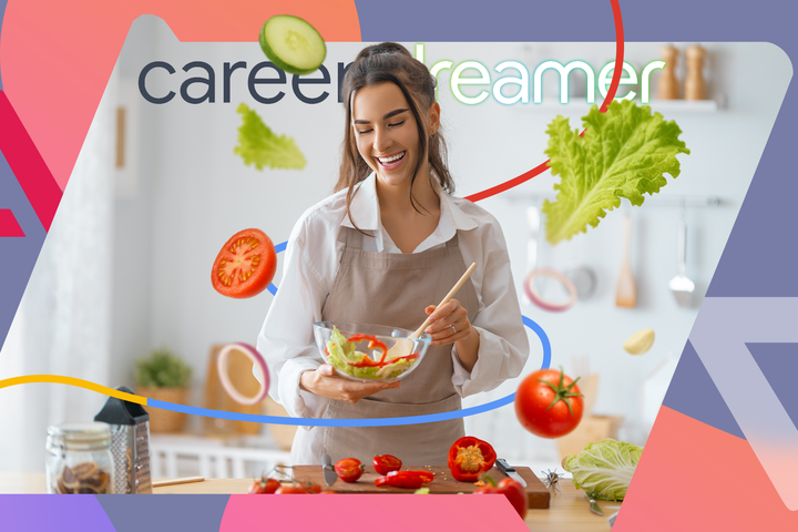 Smiling woman in a kitchen preparing a fresh salad with floating vegetables around her.