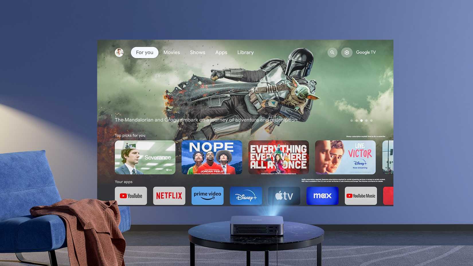 Dangbei Atom projecting from a table in a living room setting