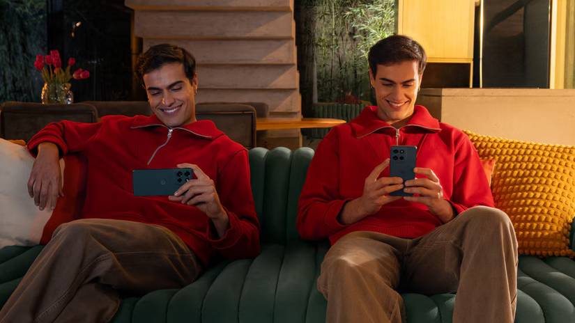 The Moto G play being used on a sofa.