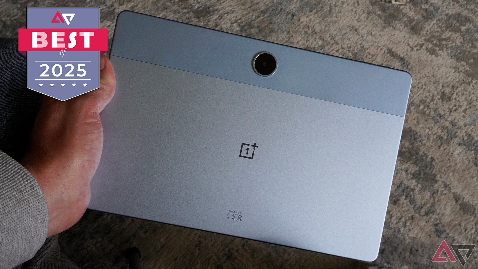 A person holding the OnePlus Pad Lite.