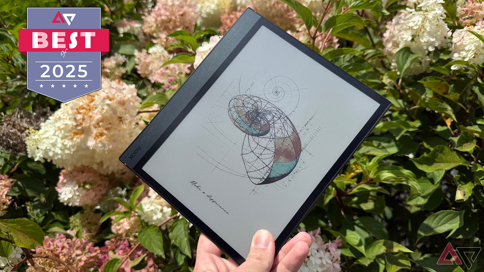 Boox Note Air4 C alongside white flowers.