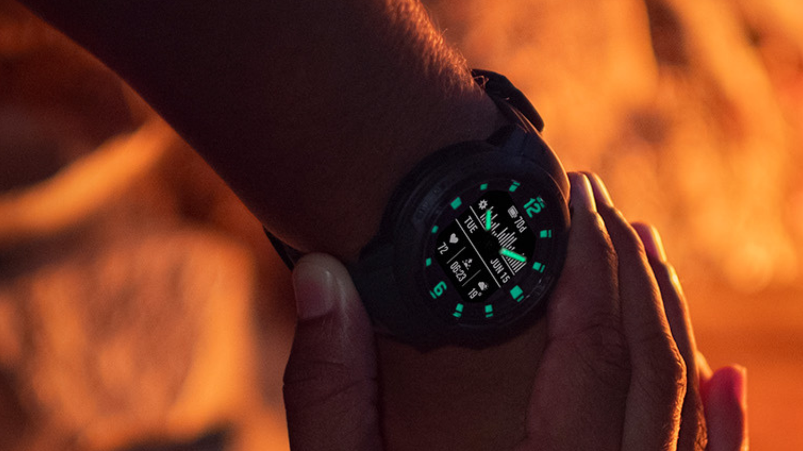 Garmin Instinct Crossover Solar on wrist at night 