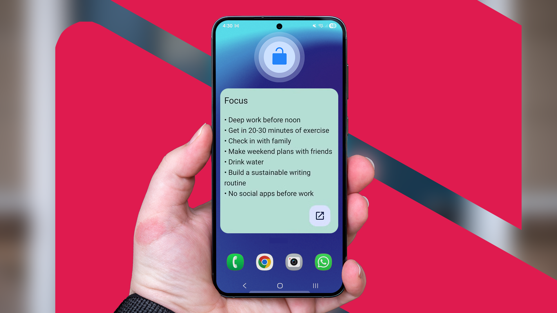 Hand holding a smartphone displaying a 'Focus' widget with a list of daily goals on the home screen.