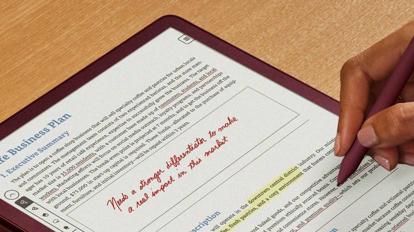 kindle-scribe-colorsoft-in-use-desk-hand-2-1