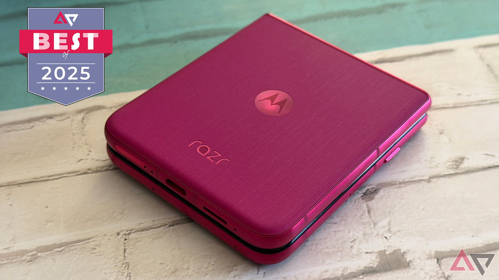 Motorola Razr Ultra 2025 in Pink Cabaret sitting on desk.