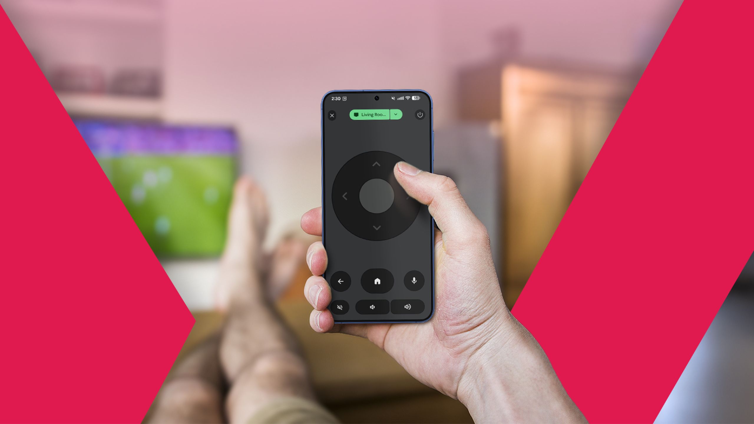 First-person view of a hand holding a smartphone remote app while relaxing on a couch in front of a TV