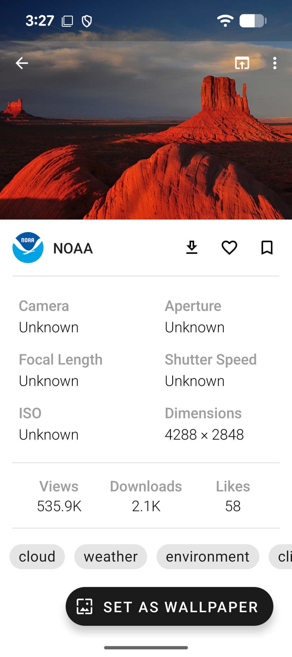 A screenshot from Resplash showing a photo of reddish rocks and its specs