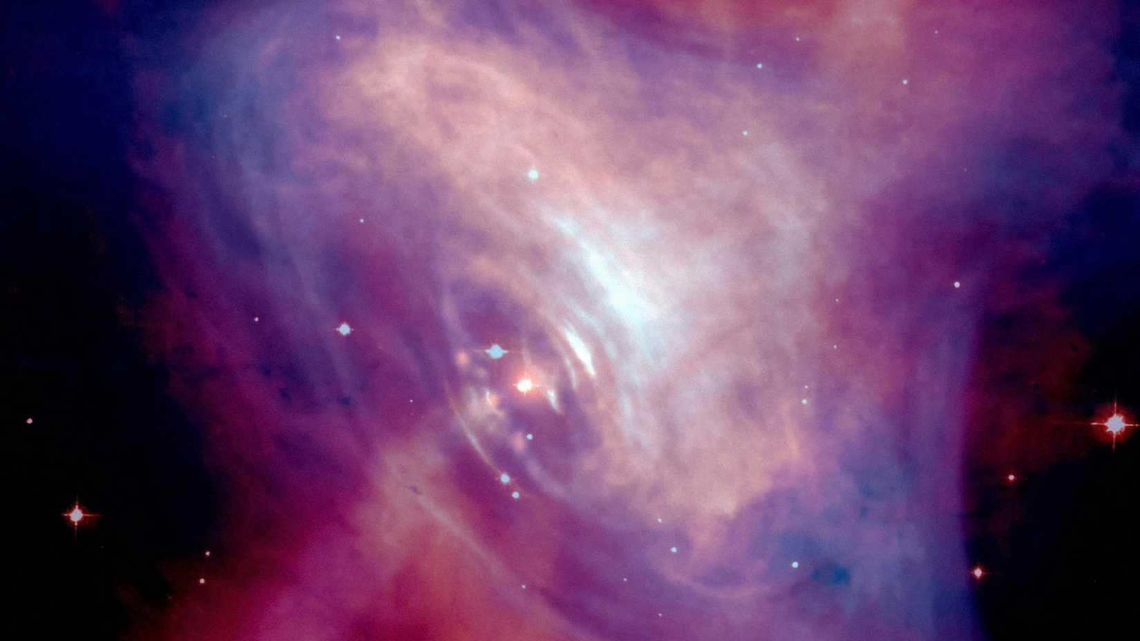 Un'immagine del telescopio spaziale Hubble di una nebulosa rosa e viola