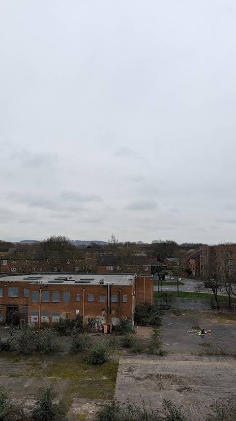 abandoned building and clouds above