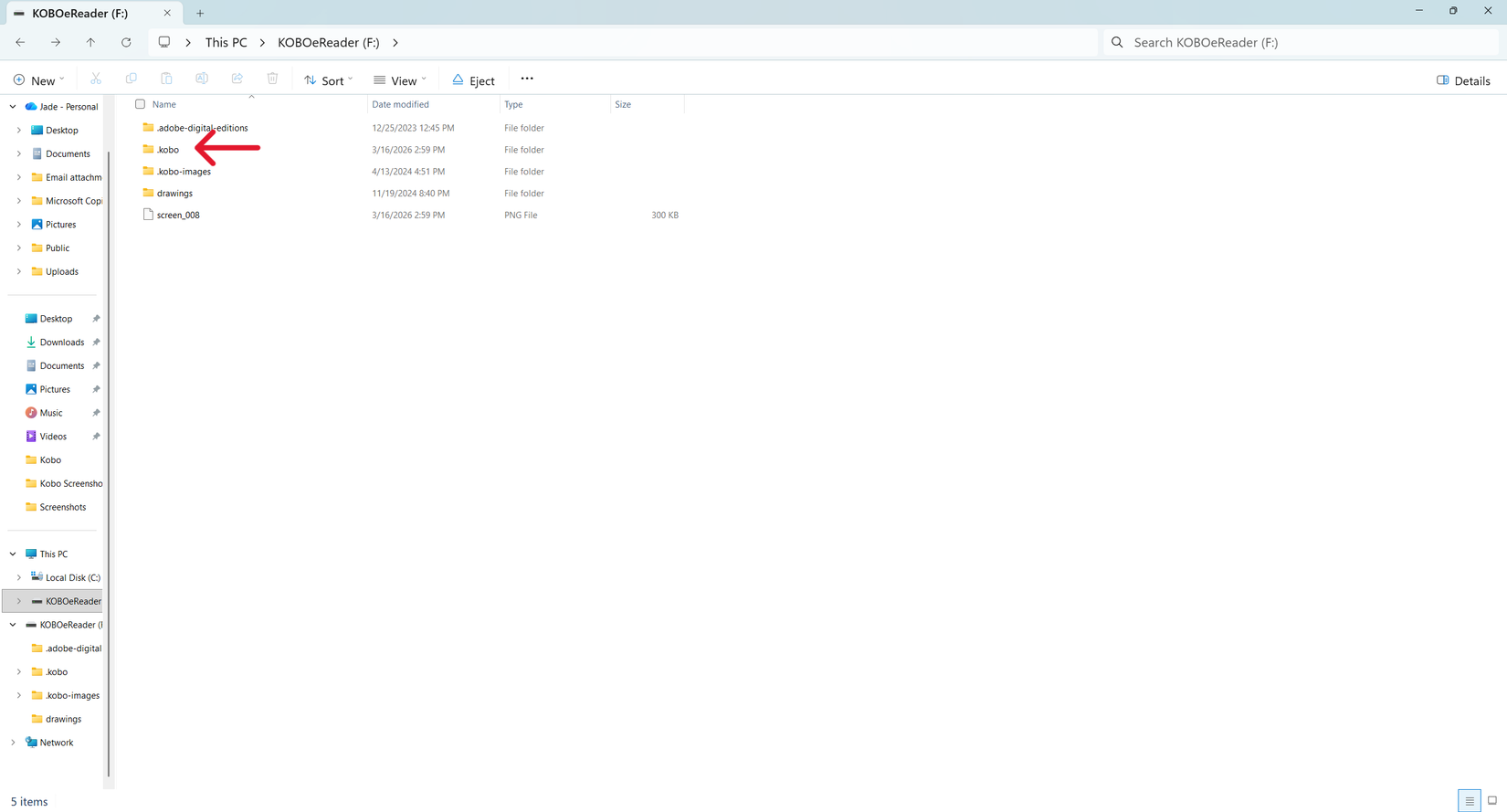 Uma captura de tela do Windows File Explorer aberta nos arquivos do Kobo, com uma seta vermelha apontando para 