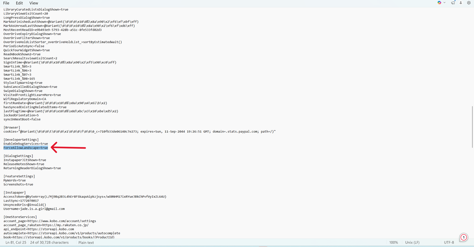 Uma captura de tela do Kobo eReader.conf aberta no Bloco de Notas, com uma seta vermelha apontando para uma linha de leitura de código 