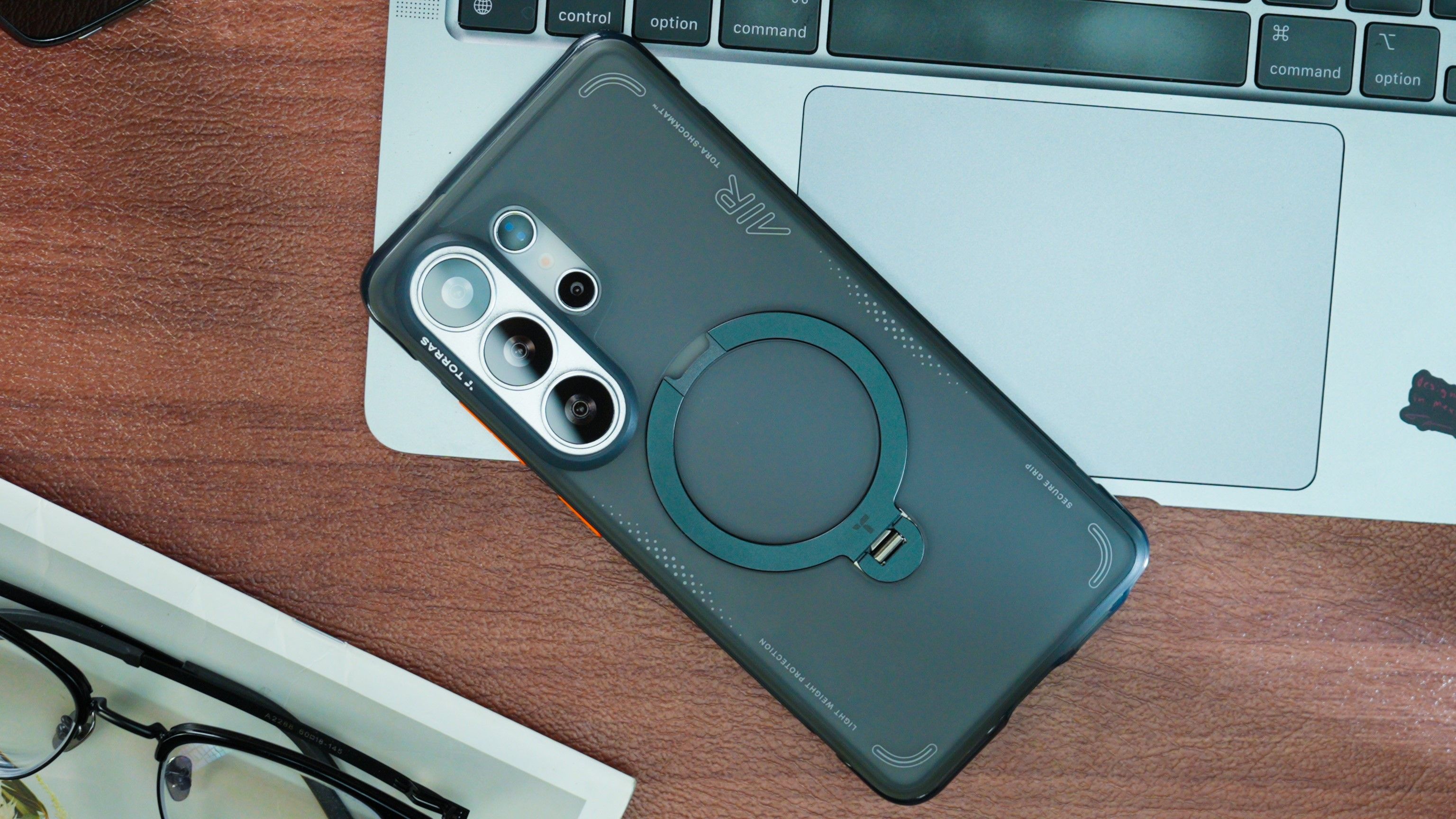 TORRA Ostand Q3 Air for Samsung Galaxy S26 Ultra on a desk with a computer