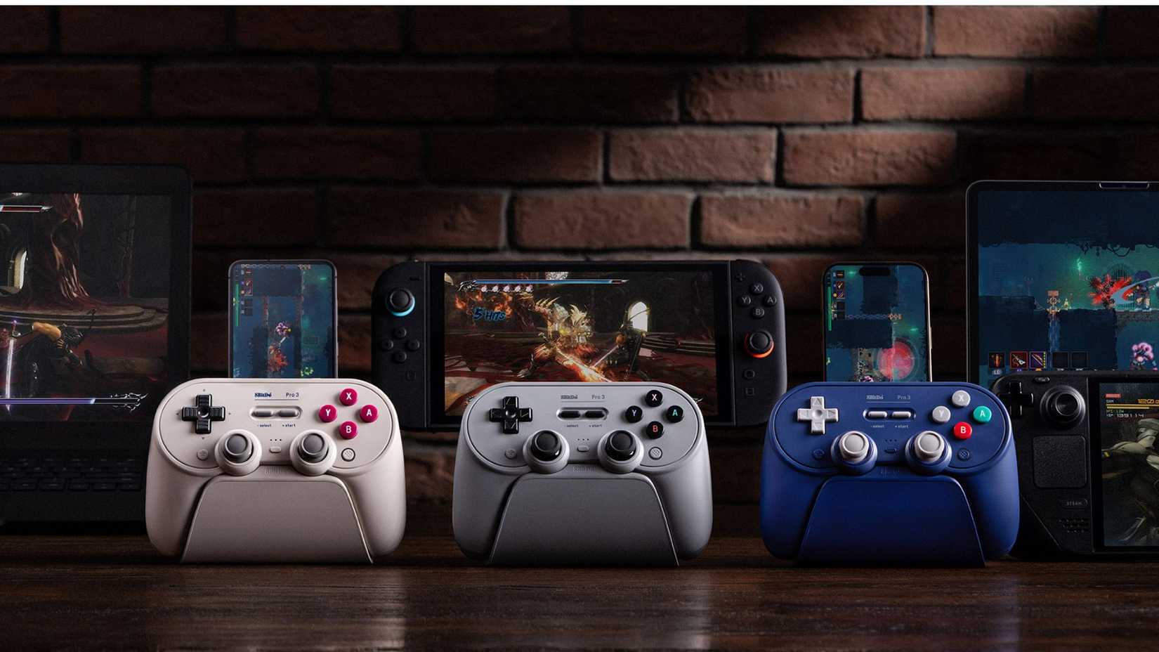 Three colors of the 8BitDo Pro 3 on table