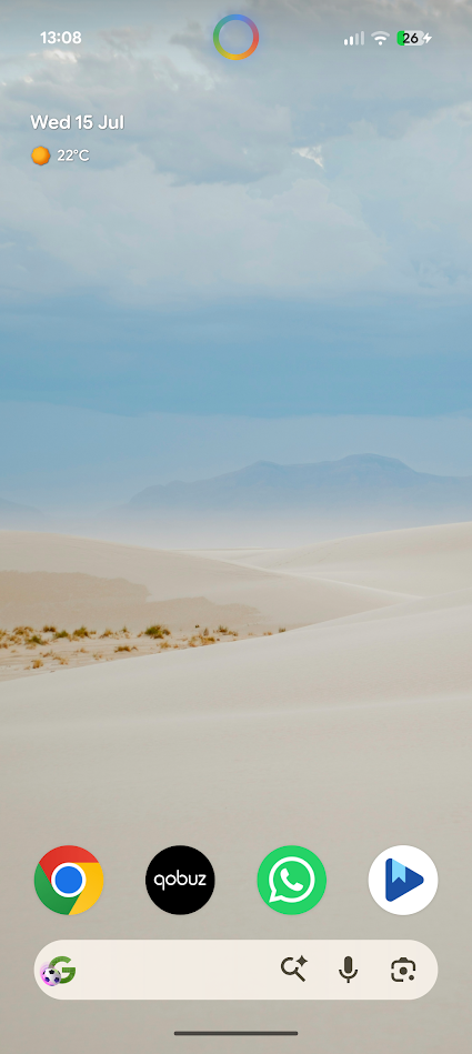 wallpaper of sandy dunes and blue sky with apps at bottom of screen