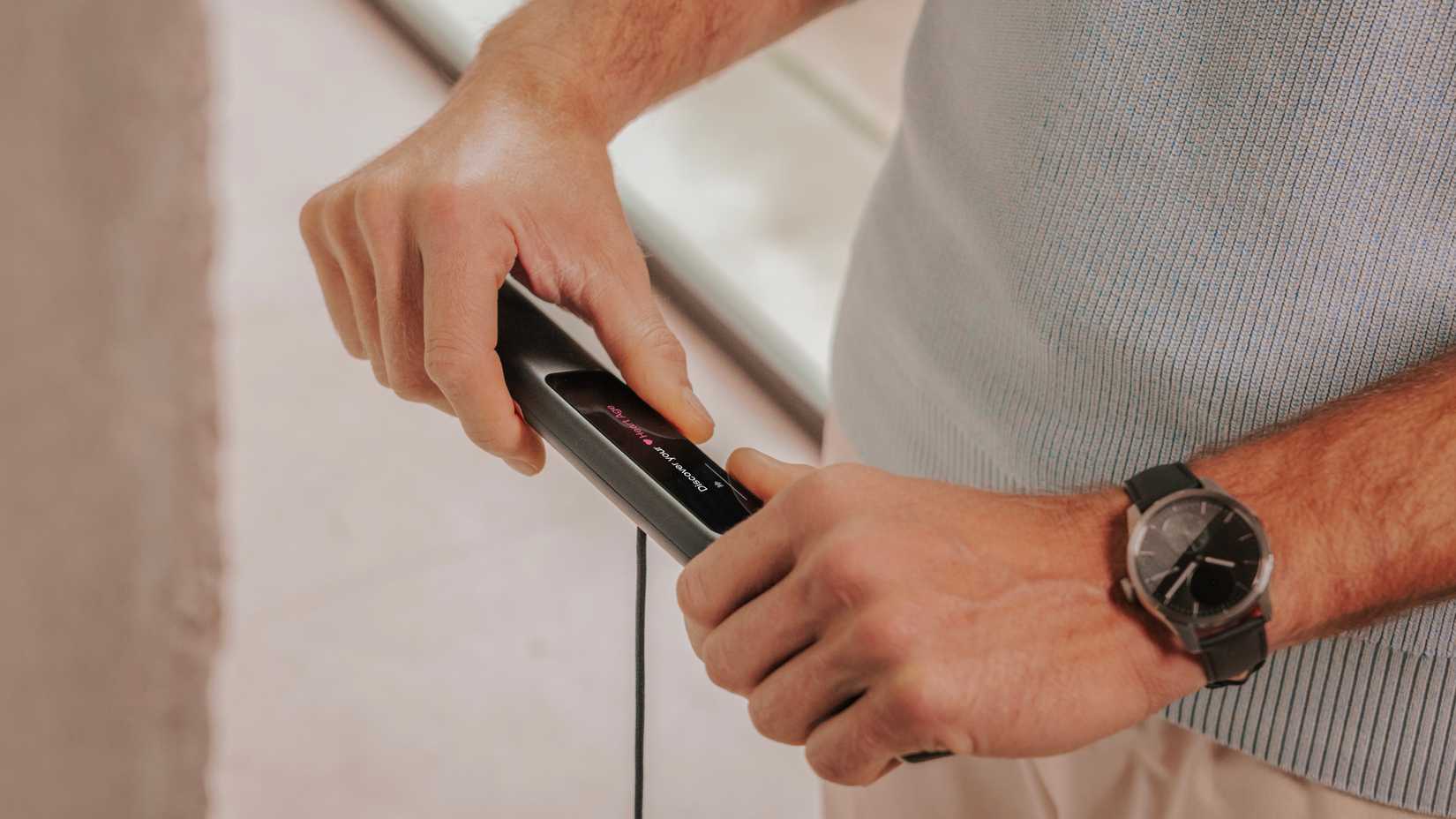 A promotional image of the Withings BodyScan 2 smart scale's handle