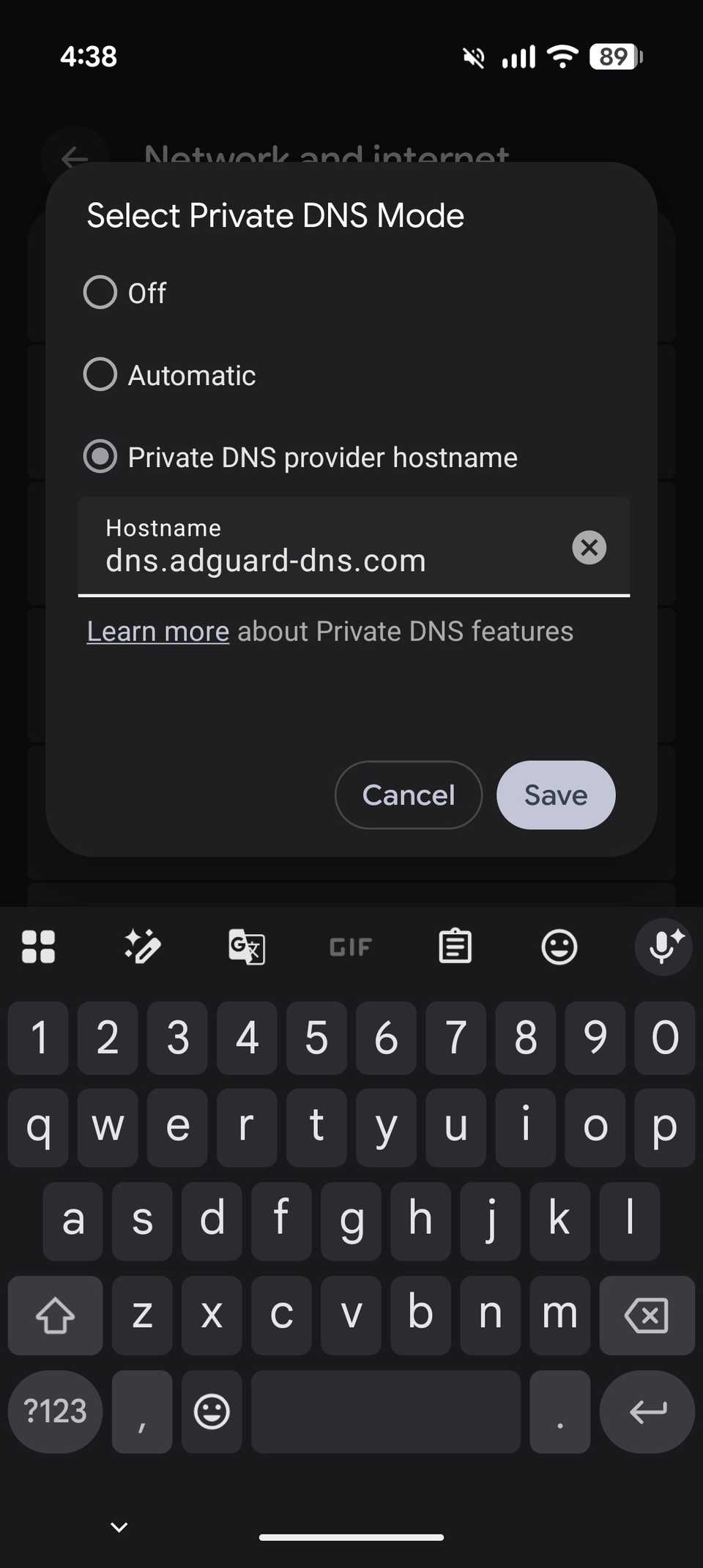 Android Private DNS configuration dialog box with AdGuard DNS hostname entered to block ads system-wide